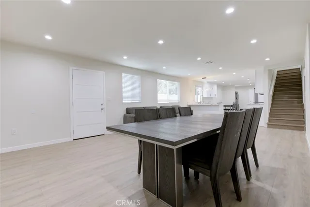 a kitchen with a table and chairs in it