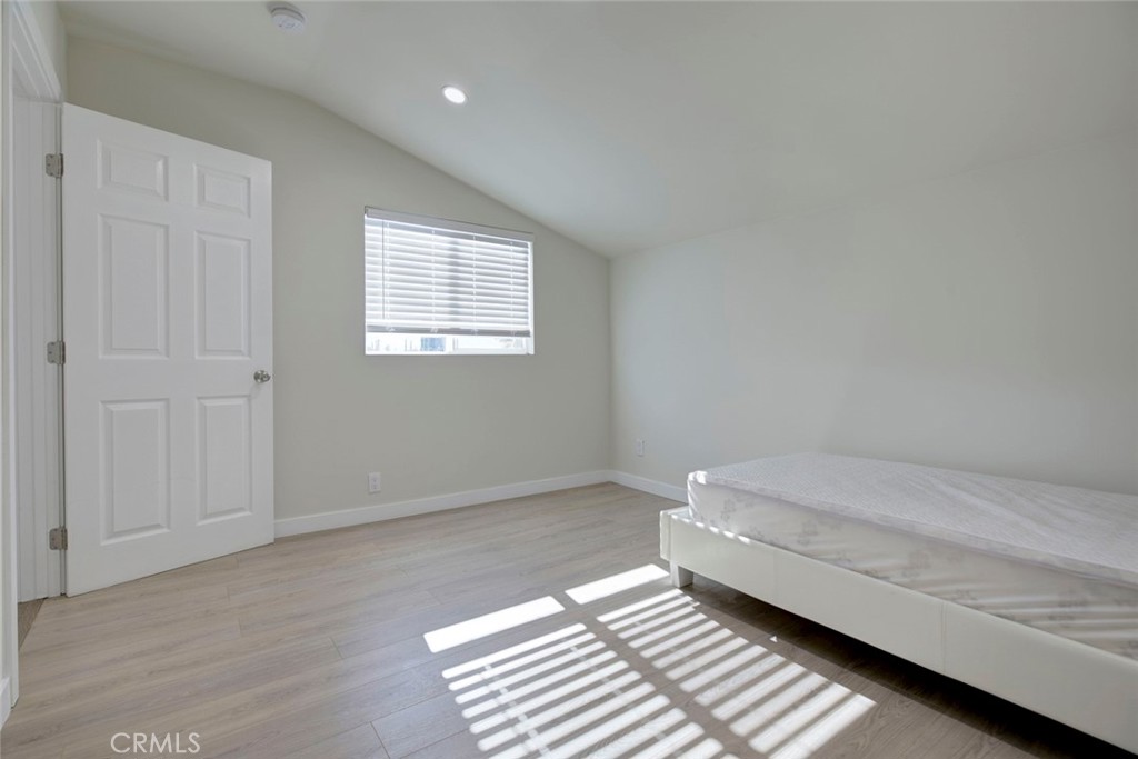 7711 Forsyth Street Tujunga, CA 91042 - Photo 24 of 35 a bedroom with a bed and window