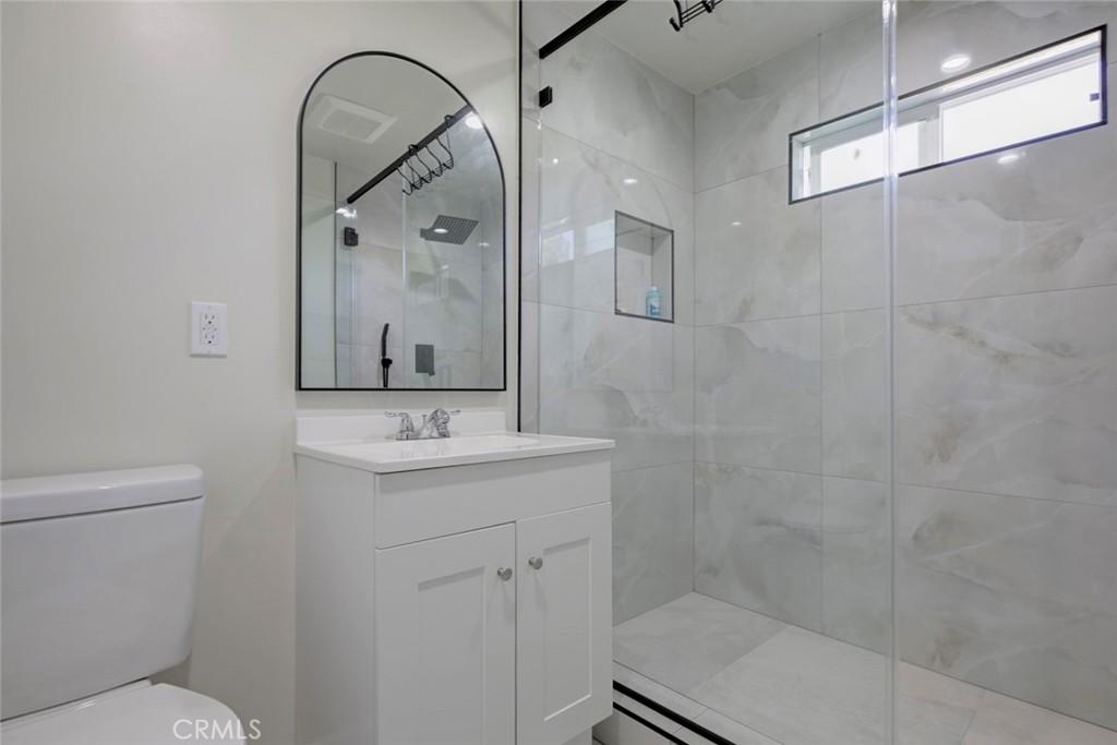 7711 Forsyth Street Tujunga, CA 91042 - Photo 27 of 35 a bathroom with a sink a toilet and shower