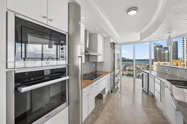 a view of walk in closet and empty room