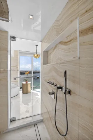 a view of a swimming pool with a yard and plants