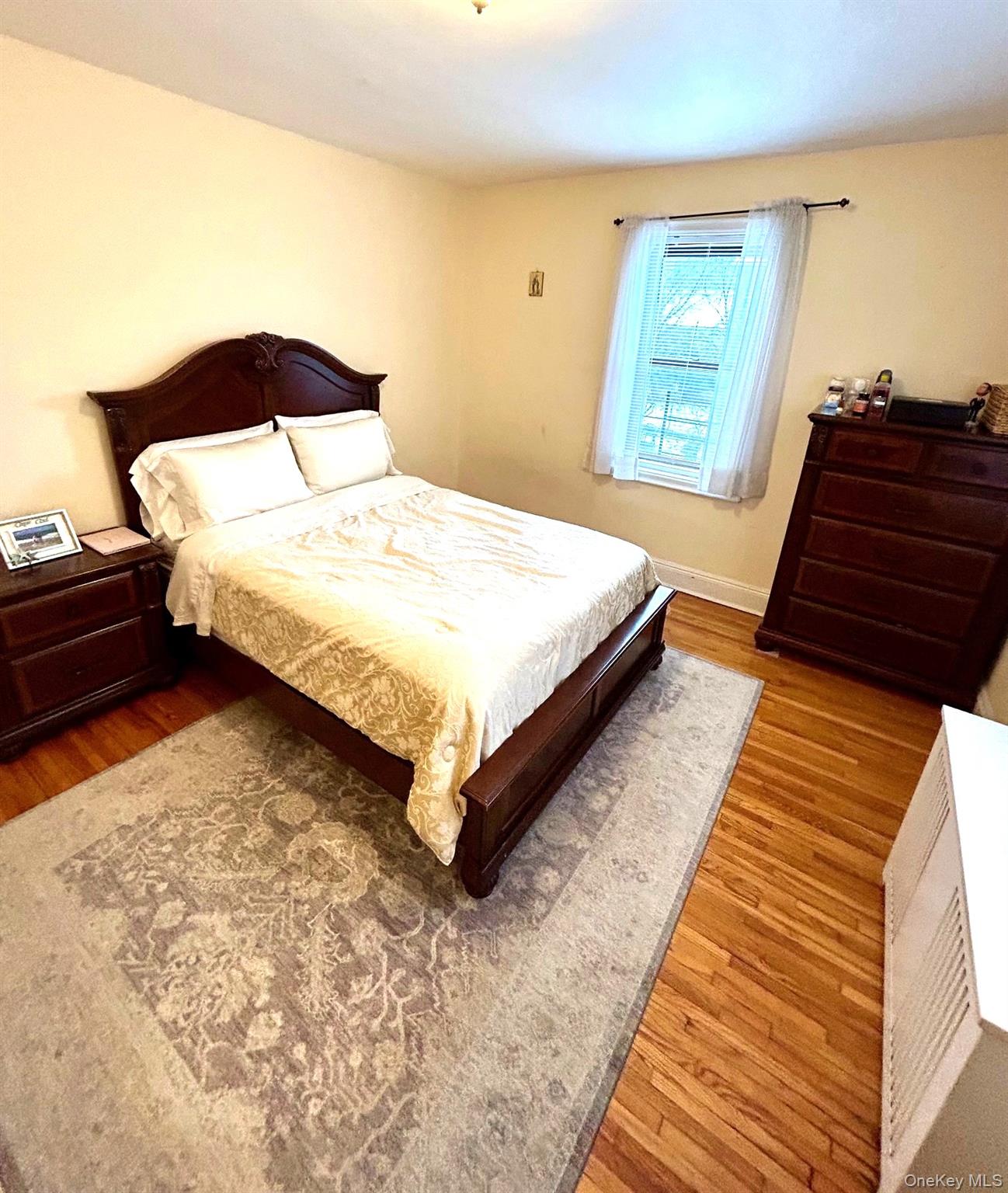 475 Bronx River Road, Unit 3G Yonkers, NY 10704 - Photo 15 of 21 a bedroom with a bed and window