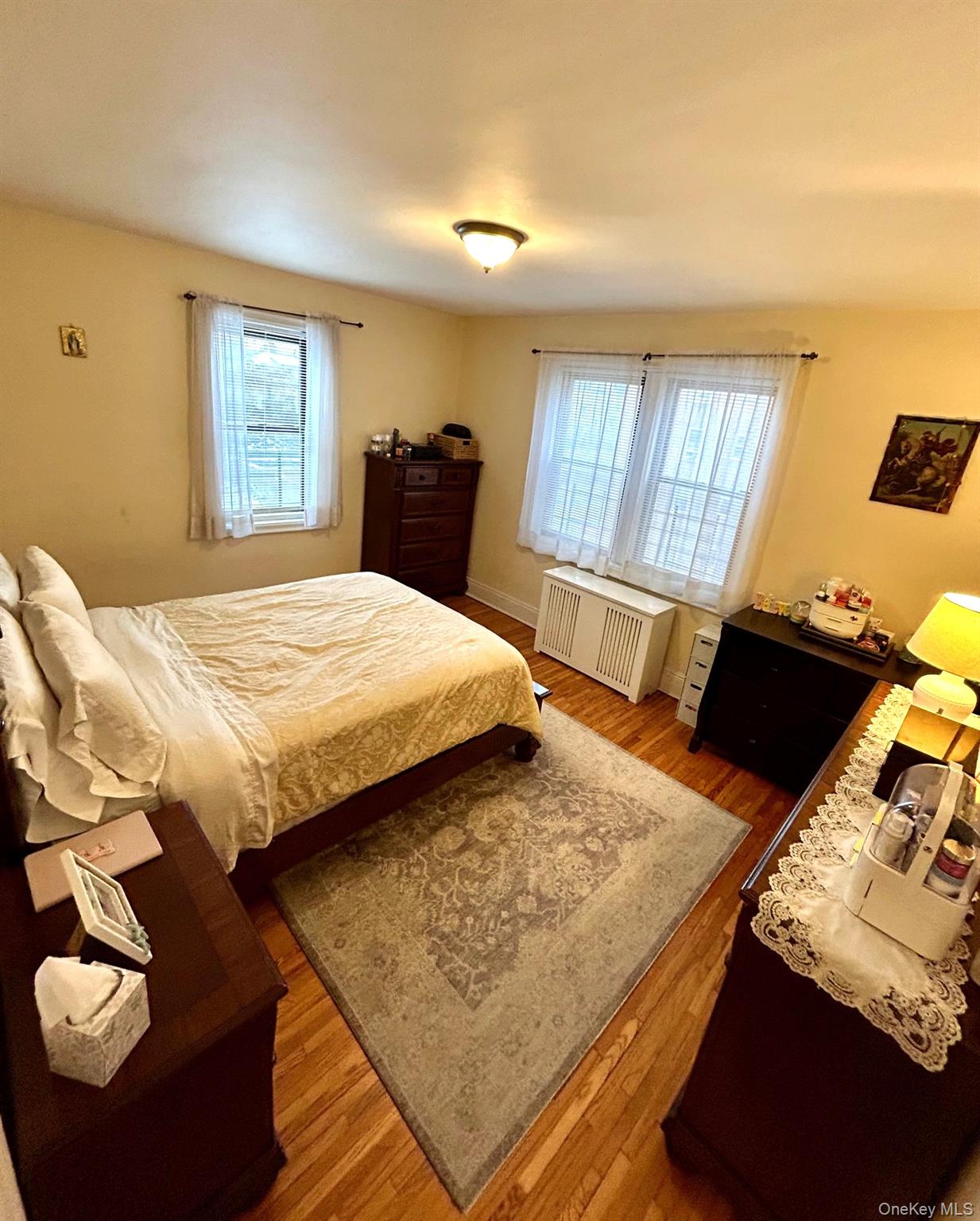 475 Bronx River Road, Unit 3G Yonkers, NY 10704 - Photo 16 of 21 a bed sitting in a bedroom next to a window