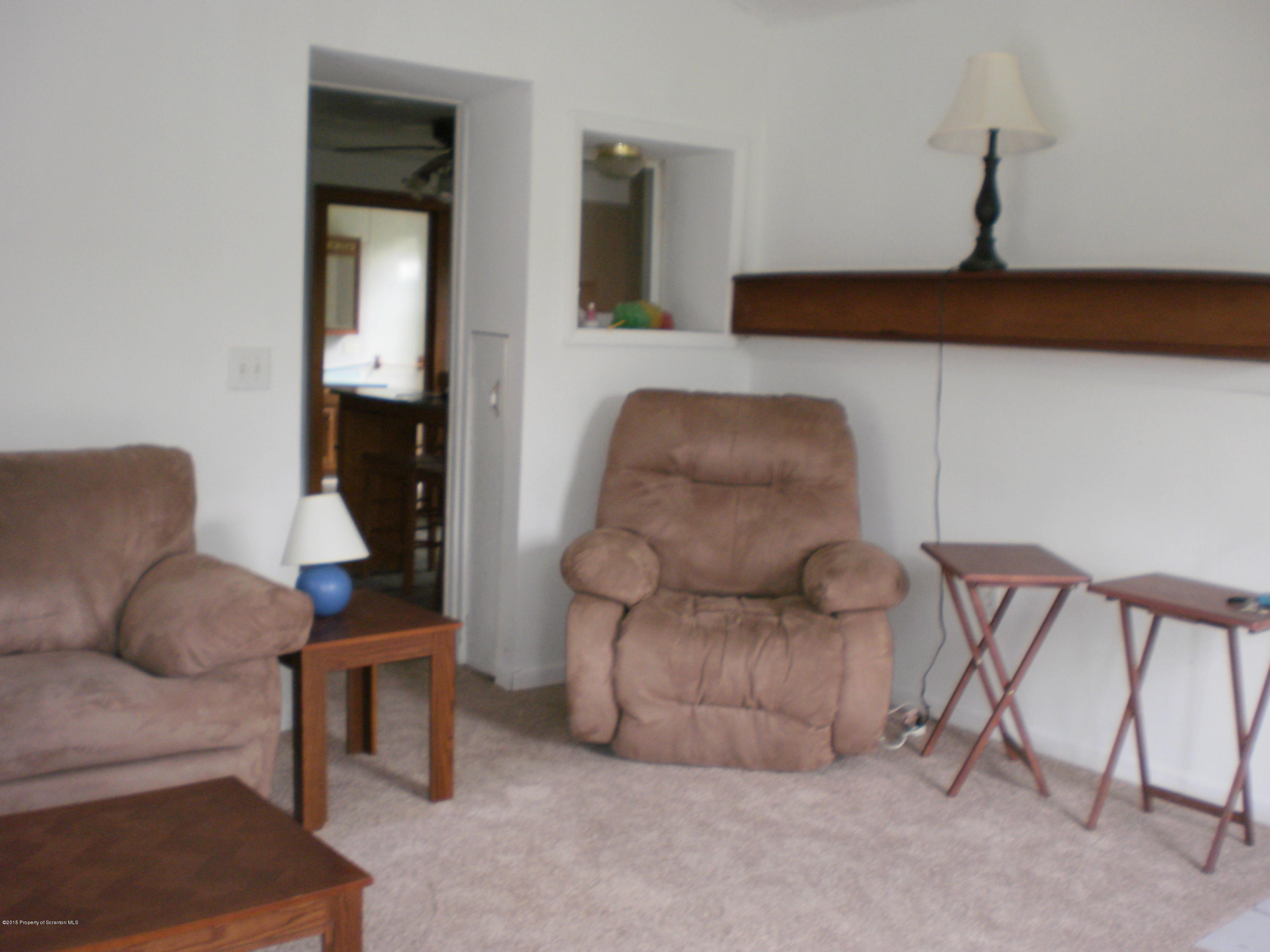 3026 West Nicholson Road Nicholson, PA 18446 - Photo 14 of 22 a living room with furniture and a window