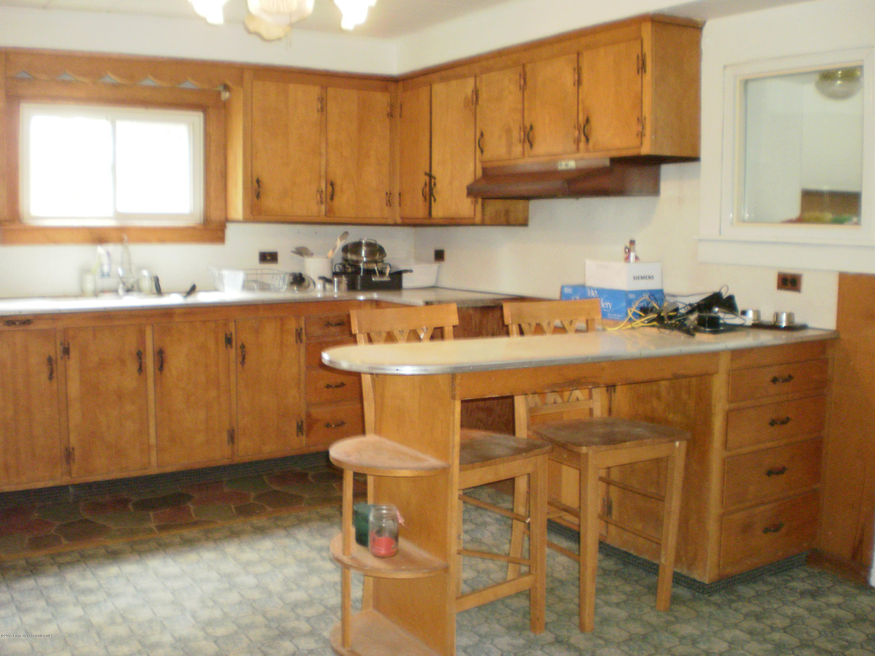 3026 West Nicholson Road Nicholson, PA 18446 - Photo 8 of 22 a kitchen with stainless steel appliances a sink a stove a refrigerator and cabinets