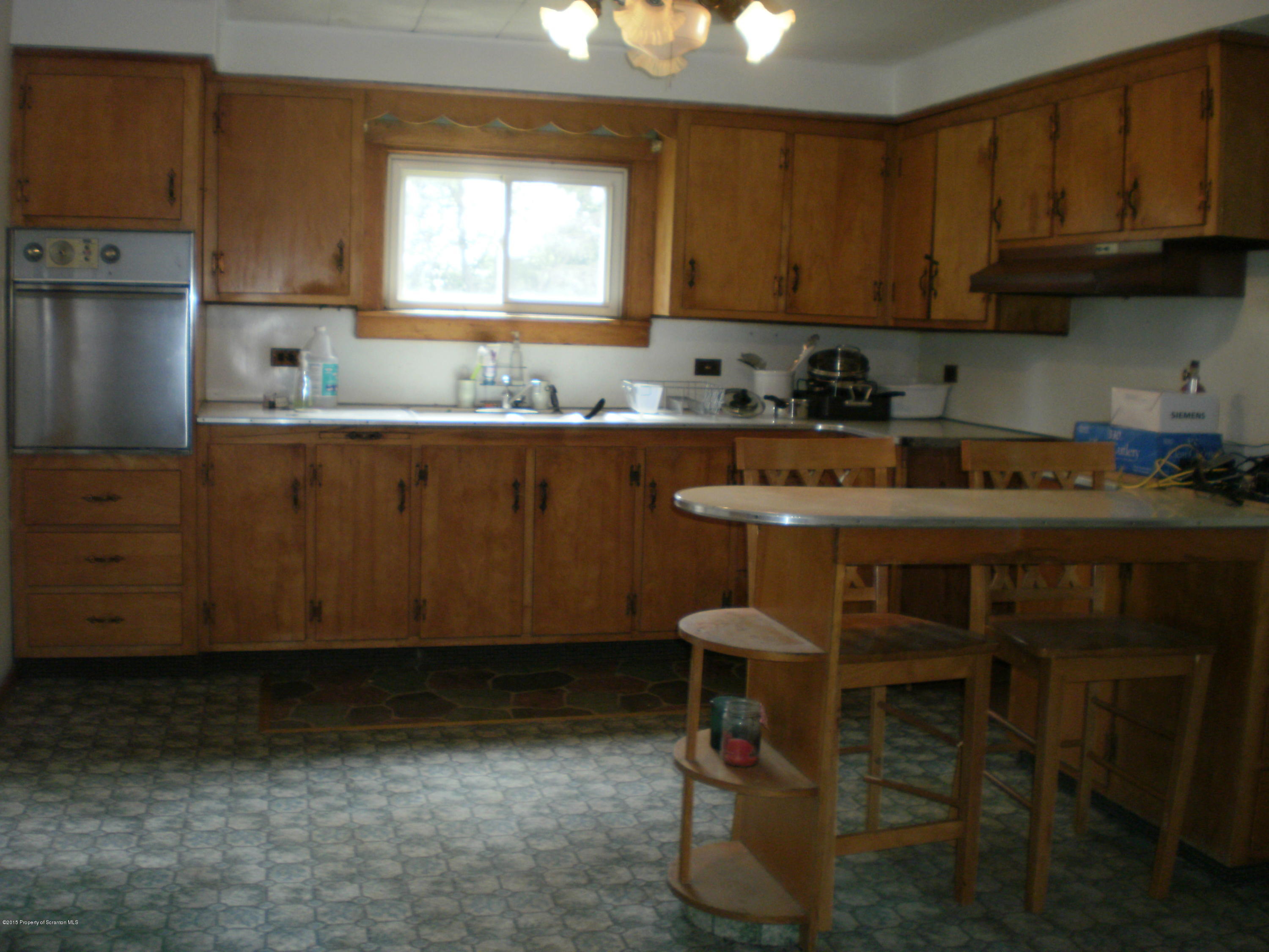 3026 West Nicholson Road Nicholson, PA 18446 - Photo 9 of 22 a kitchen with a sink cabinets and window