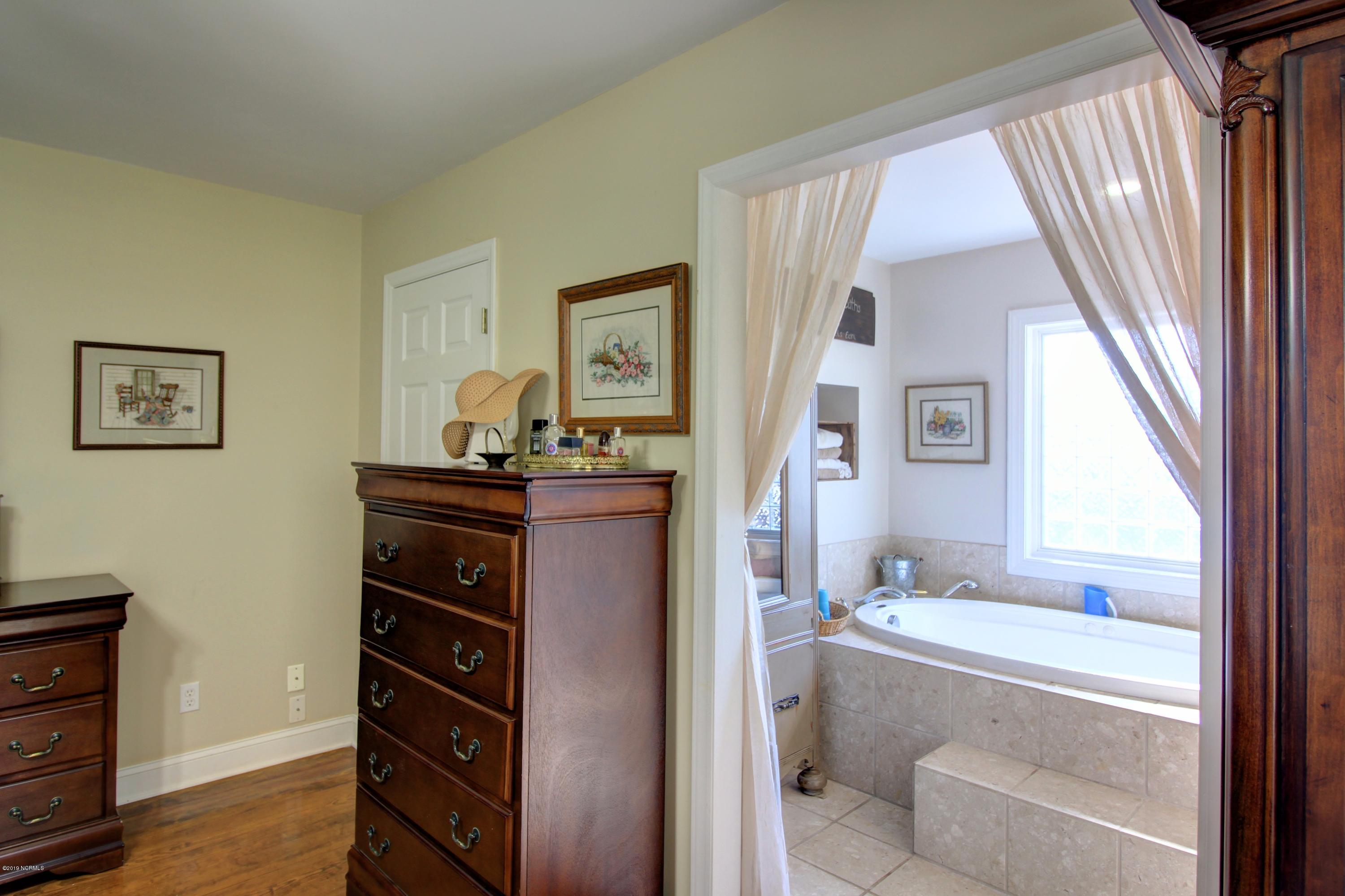 1095 Roberts Road Newport, NC 28570 - Photo 17 of 35 Master Bedroom into the Master Bath