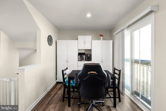a view of a dining room with furniture and window