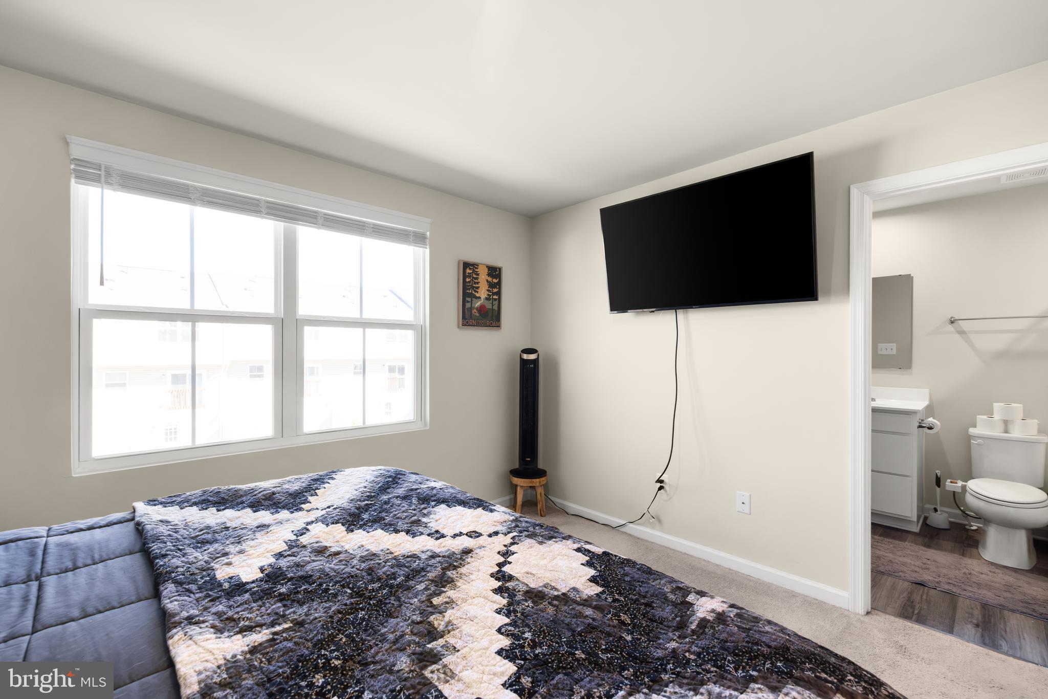 272 Rhea Drive Martinsburg, WV 25403 - Photo 19 of 27 a bedroom with a bed and a flat screen tv