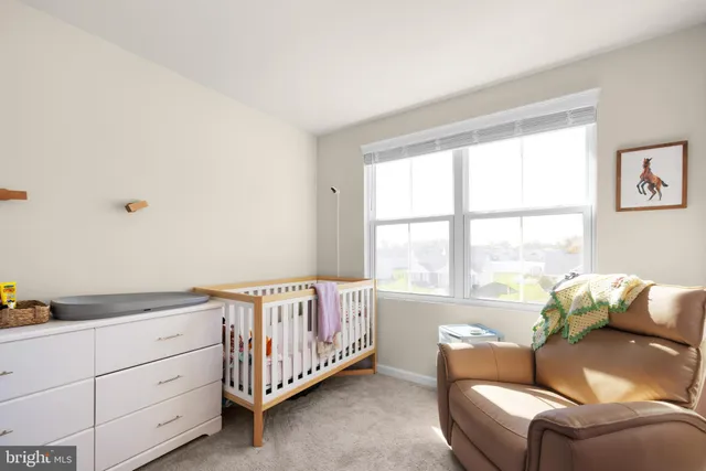 a bed room with a bed and a window