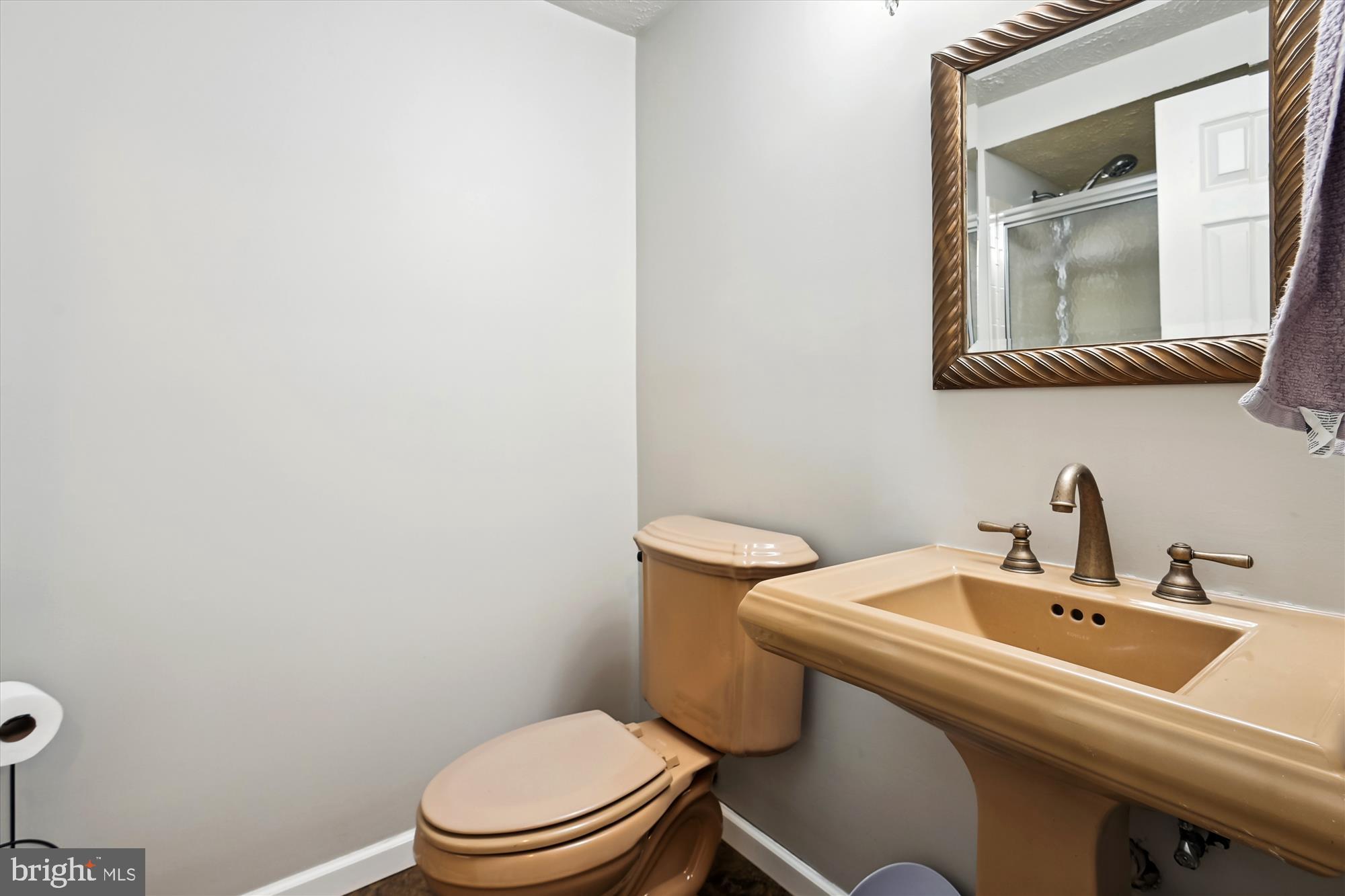 1517 Autumn Ridge Circle Reston, VA 20194 - Photo 32 of 37 a bathroom with a sink a mirror and a toilet
