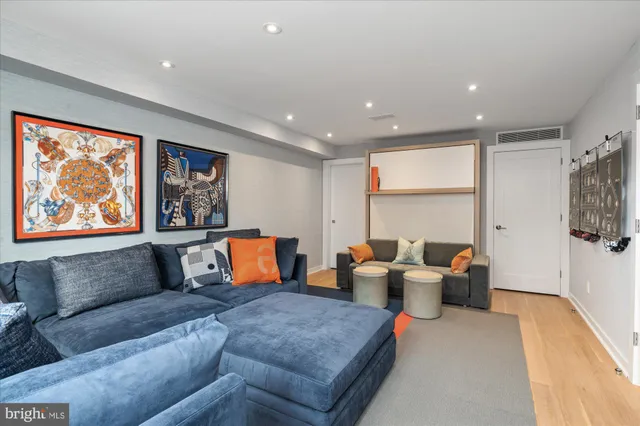 a living room with furniture a large window and a couch