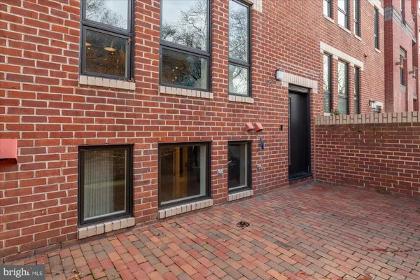 a view of a brick house with an outdoor space