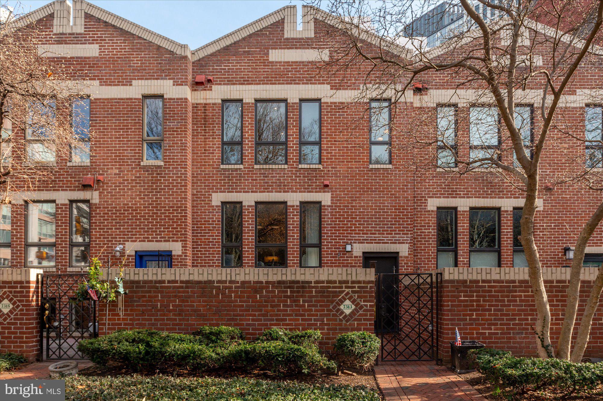 7313 Woodmont Avenue, Unit R Bethesda, MD 20814 - Photo 3 of 29 front view of a house with a yard