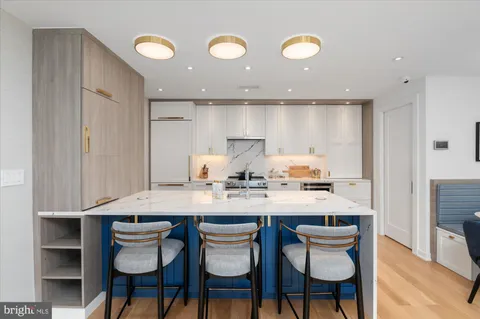 a kitchen with a table and chairs in it