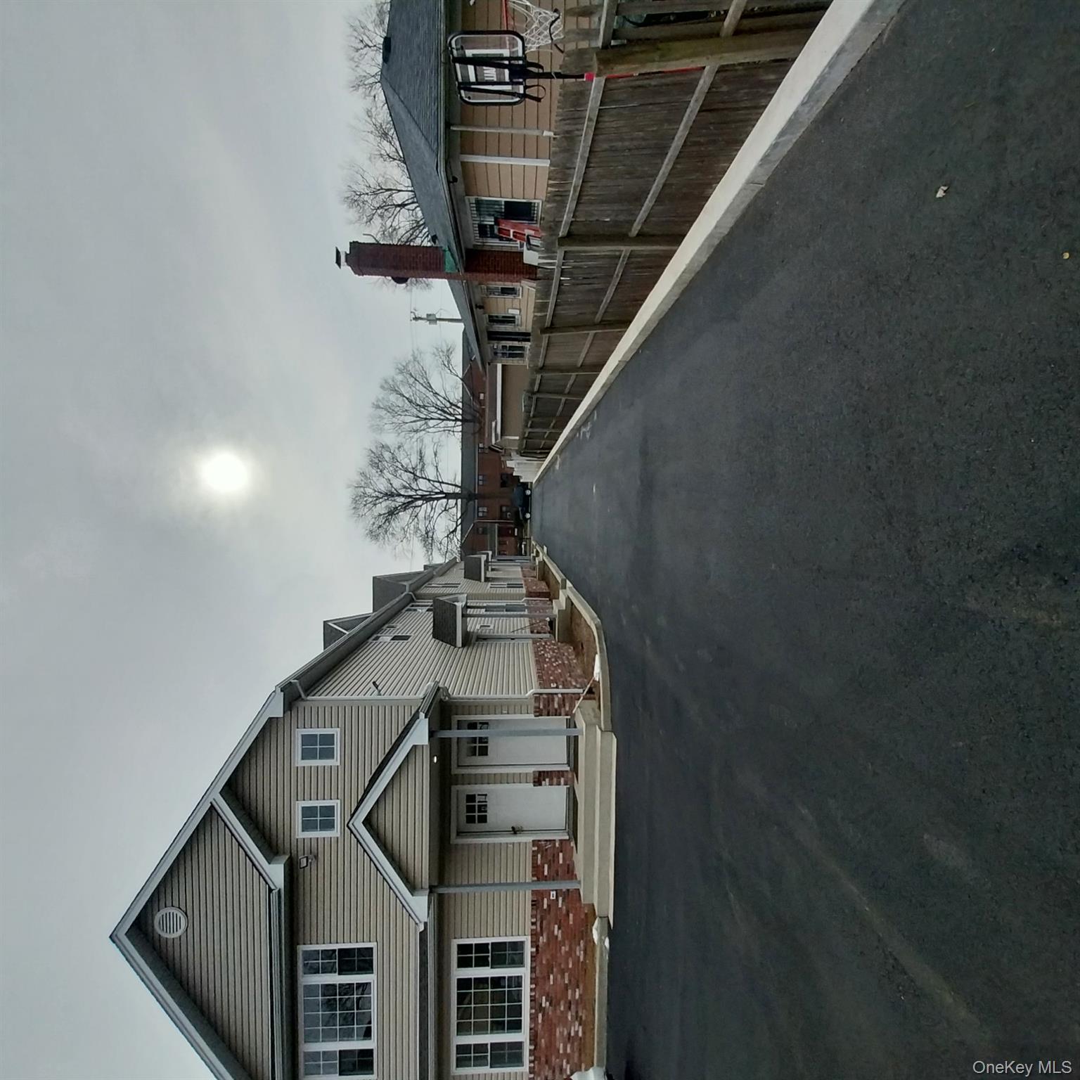 343 Jackson Street, Unit 1 Hempstead, NY 11550 - Photo 31 of 31 a front view of a house with a yard