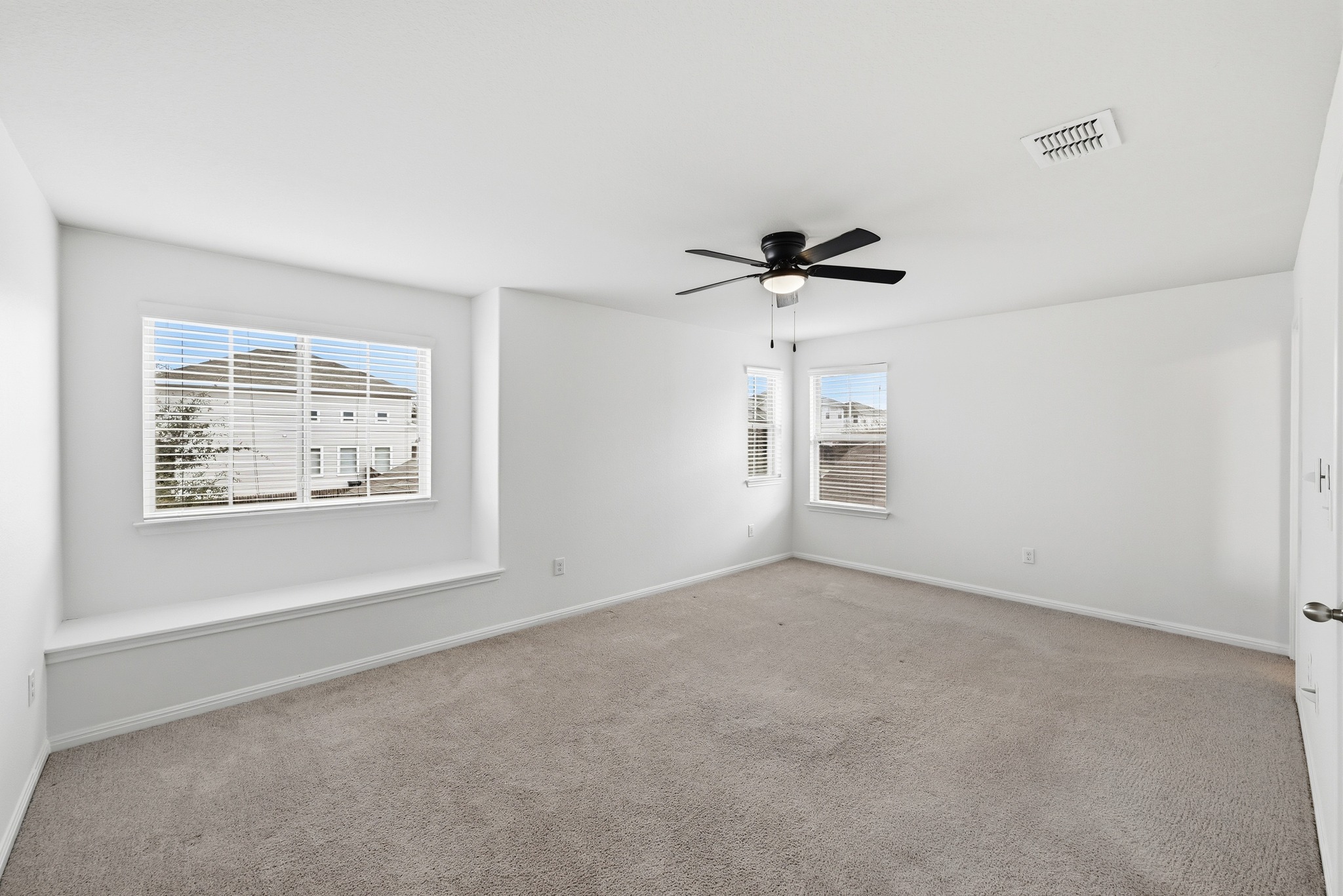 171 Vestral Road Buda, TX 78610 - Photo 16 of 26 Primary bedroom, located upstairs, with built- in window seat, walk in closet, and ensuite bath