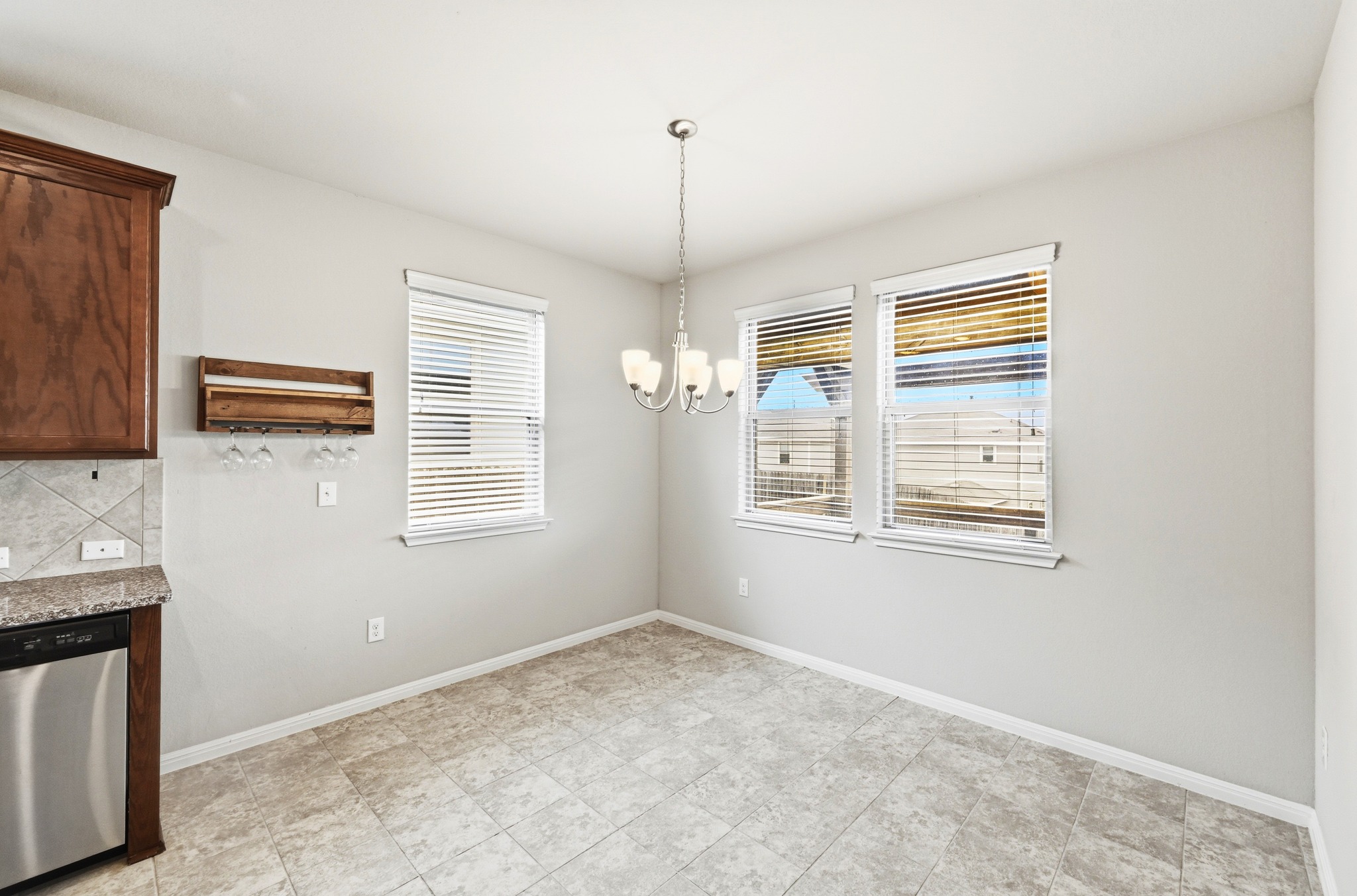 171 Vestral Road Buda, TX 78610 - Photo 9 of 26 Breakfast area overlooking rear deck and yard.