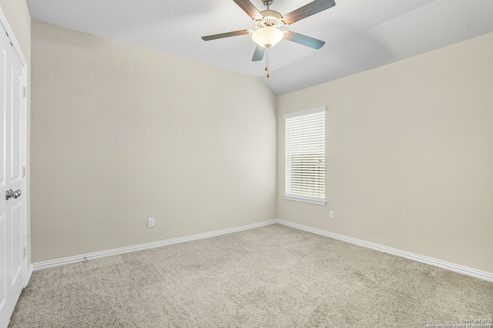 9825 Jon Boat Way Boerne, TX 78006 - Photo 19 of 25 an empty room with a window and a fan