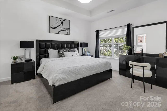 a bedroom with bed and window