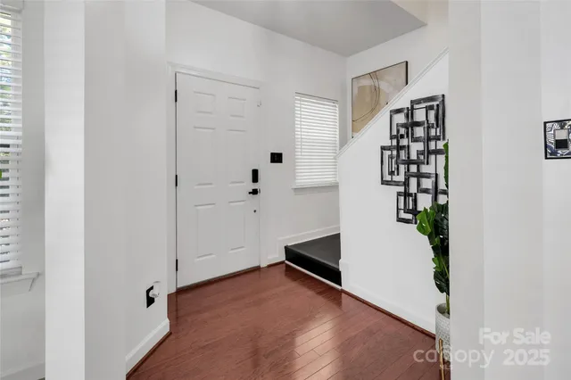 an entryway with a white walls
