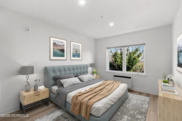 a bedroom with bed and a window