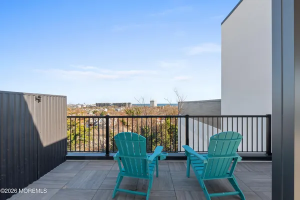 swimming pool view with a seating space