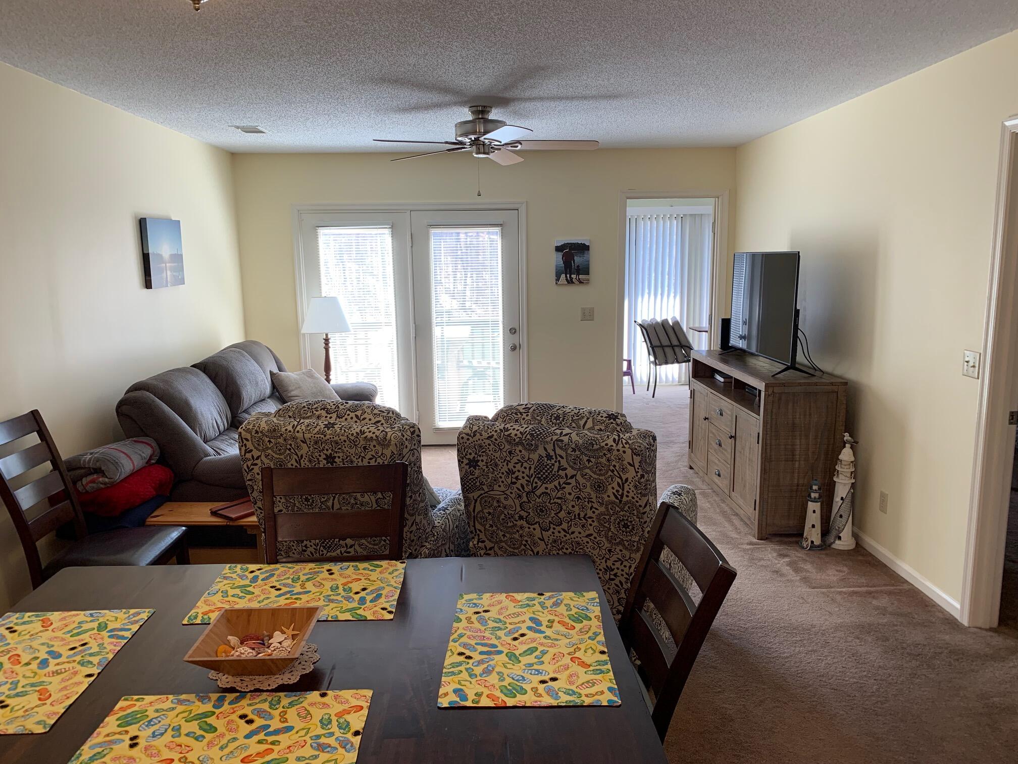 610 Monte Vista Road, Unit 706 Union Hall, VA 24176 - Photo 13 of 25 a living room with furniture and a flat screen tv