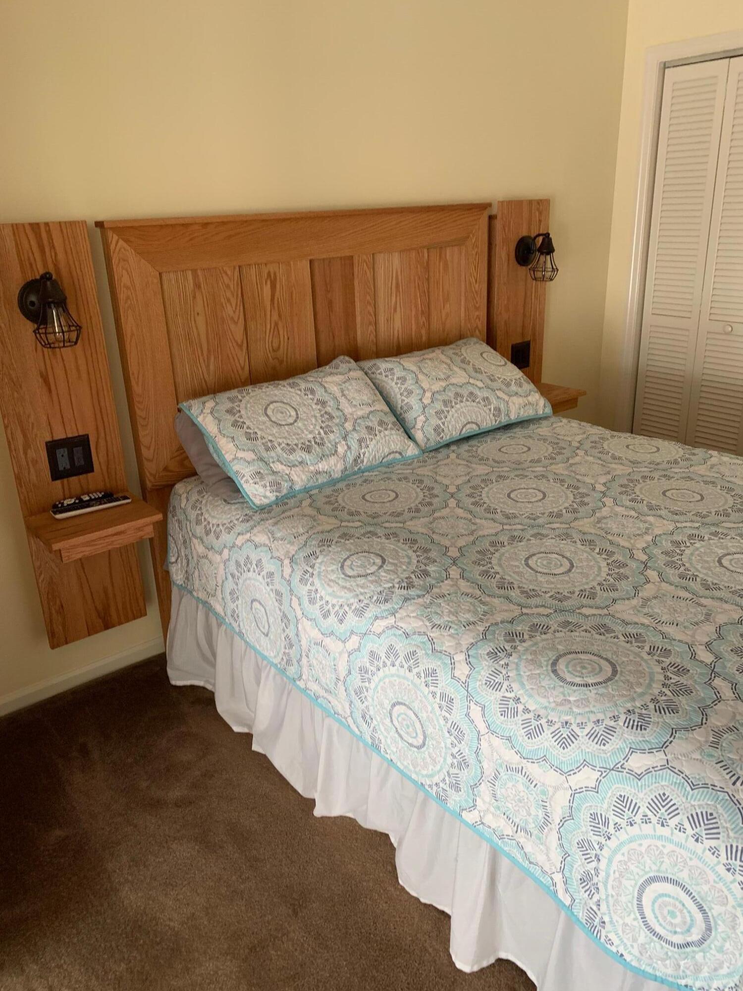 610 Monte Vista Road, Unit 706 Union Hall, VA 24176 - Photo 16 of 25 a bedroom with a bed and wooden floor