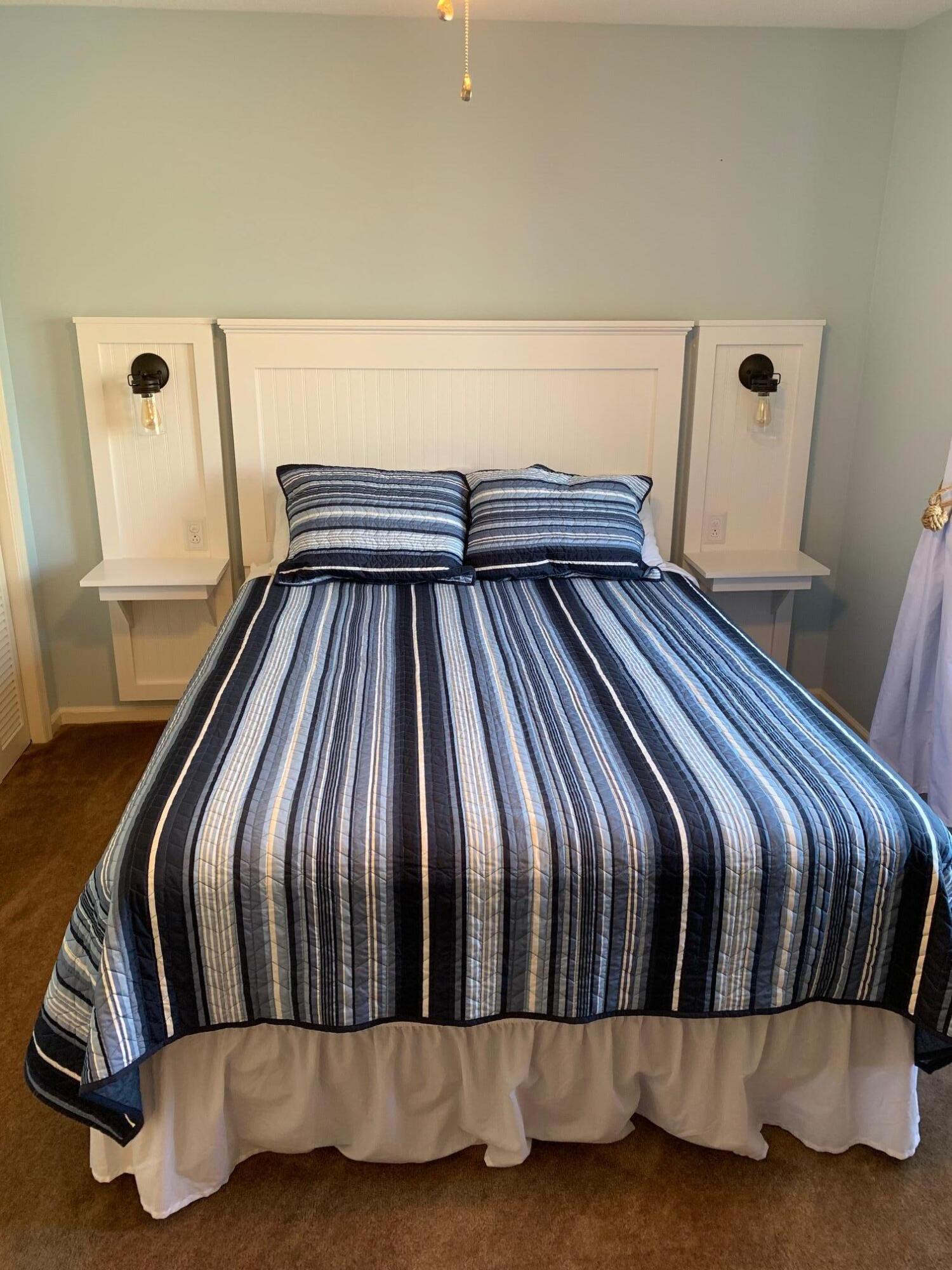 610 Monte Vista Road, Unit 706 Union Hall, VA 24176 - Photo 4 of 25 a bedroom with a bed and wooden floor
