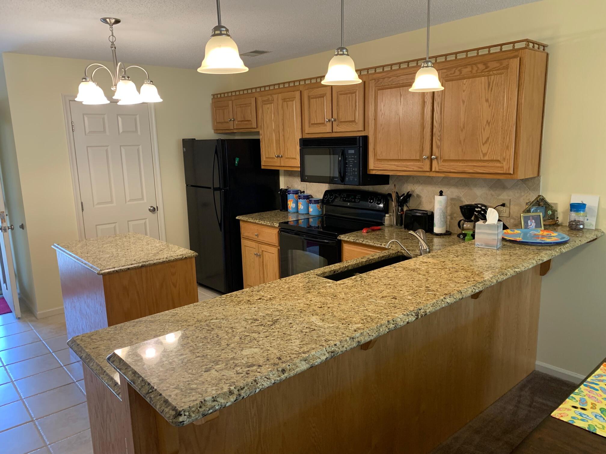 610 Monte Vista Road, Unit 706 Union Hall, VA 24176 - Photo 8 of 25 a kitchen with stainless steel appliances granite countertop a sink a stove and a refrigerator