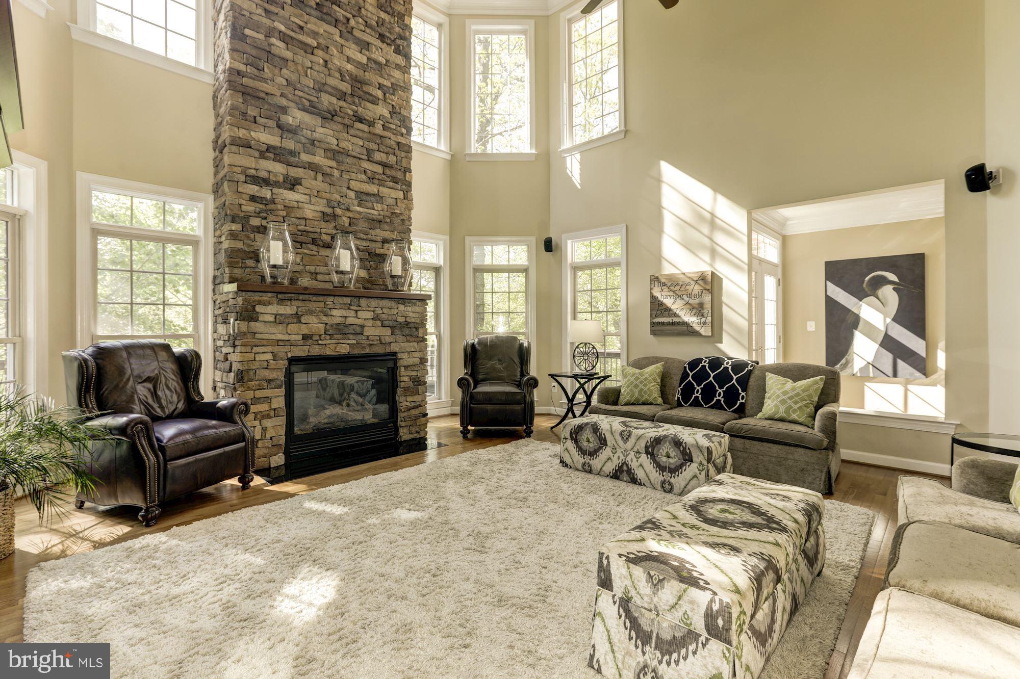 43285 Overview Place Leesburg, VA 20176 - Photo 28 of 91 Stone floor to ceiling gas fireplace and mantle