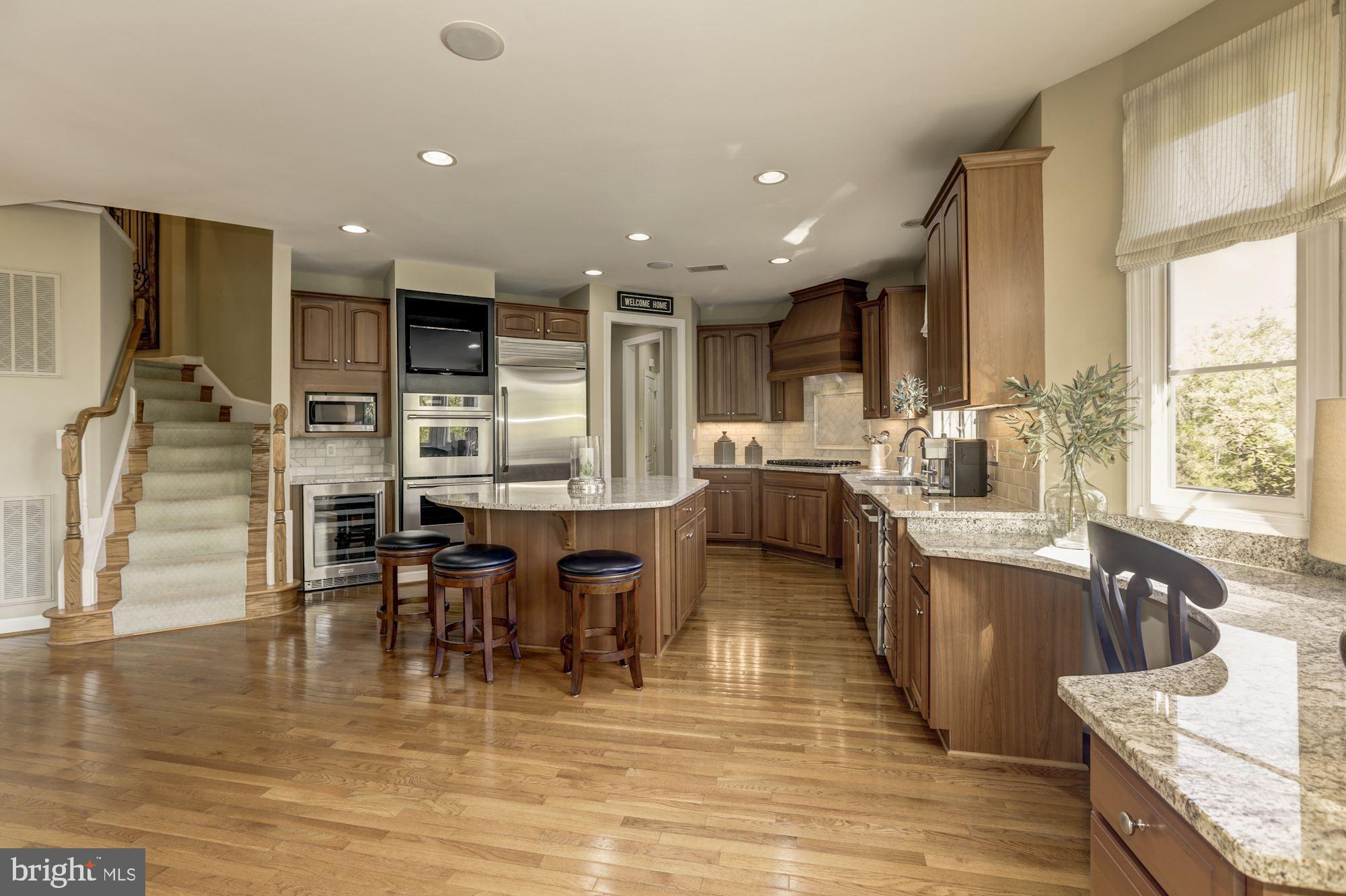 43285 Overview Place Leesburg, VA 20176 - Photo 34 of 91 Sitting area to kitchen hardwood split staircase