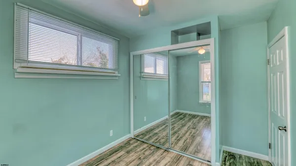 a view of a room that has a bed