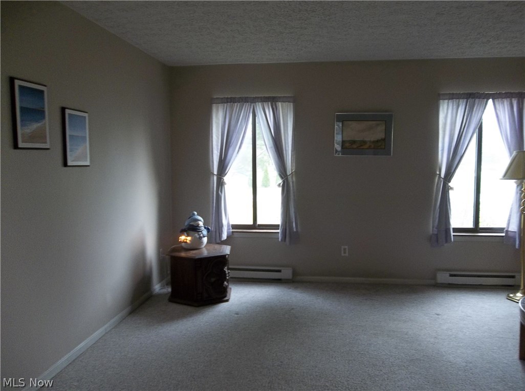 70 Boulder Ridge Place Painesville, OH 44077 - Photo 2 of 26 Neutral living room that is open to the formal dining room!
