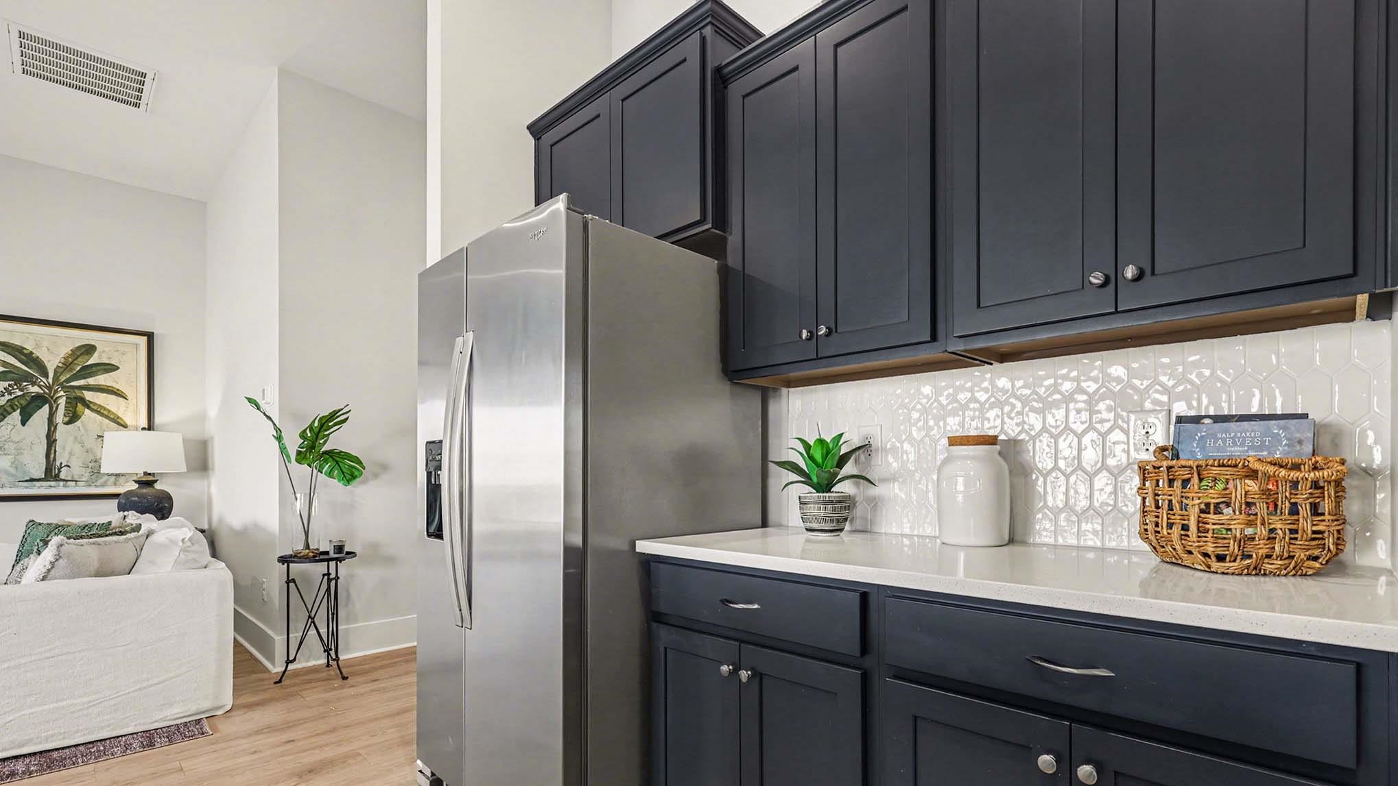 3250 Moss Bridge Lane Myrtle Beach, SC 29579 - Photo 29 of 29 Kitchen with stainless steel fridge, light stone counters, backsplash, light wood-style flooring, and open floor plan