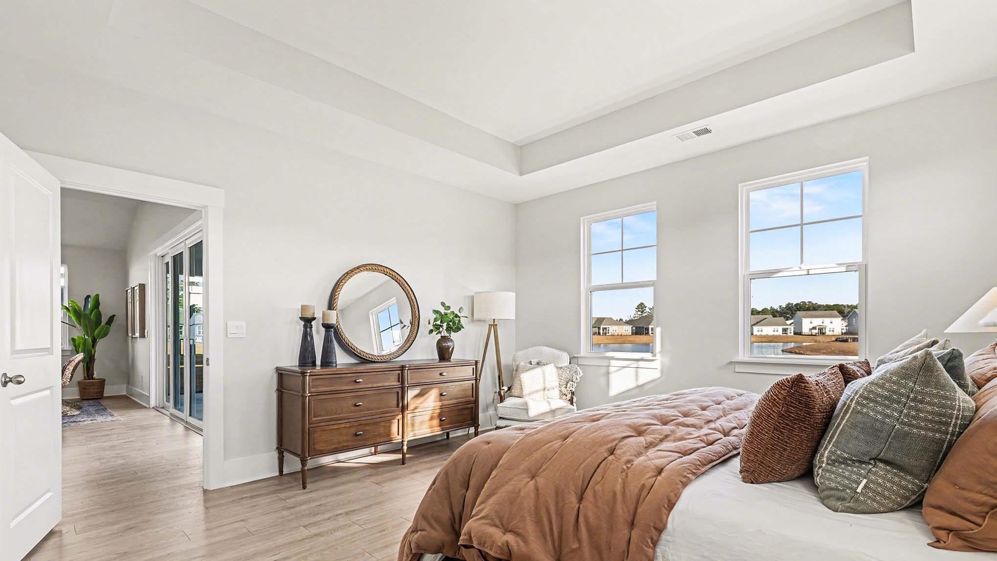 3250 Moss Bridge Lane Myrtle Beach, SC 29579 - Photo 14 of 29 Bedroom with a tray ceiling and light wood-style floors