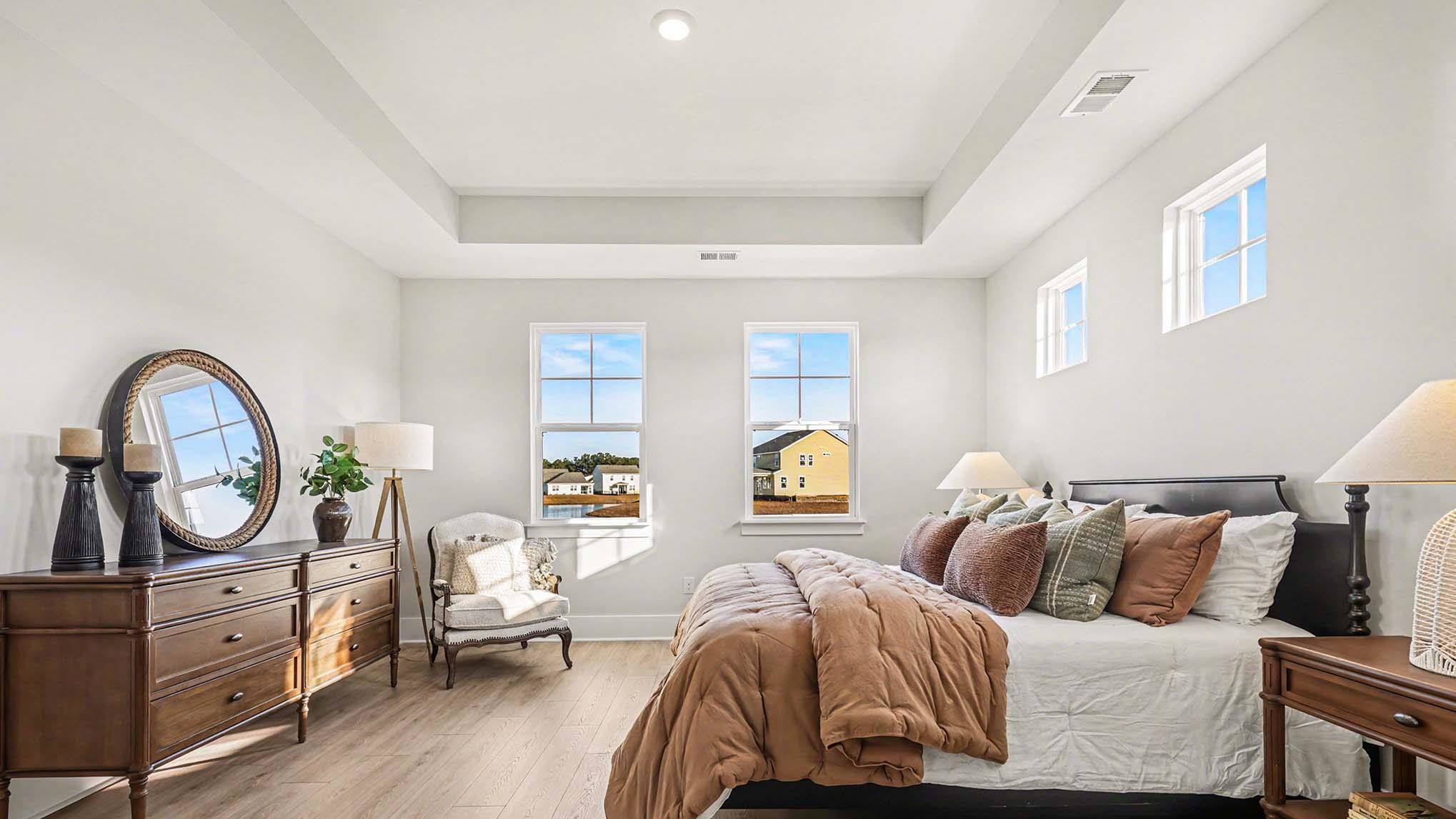 3250 Moss Bridge Lane Myrtle Beach, SC 29579 - Photo 16 of 29 Bedroom with wood finished floors and a raised ceiling