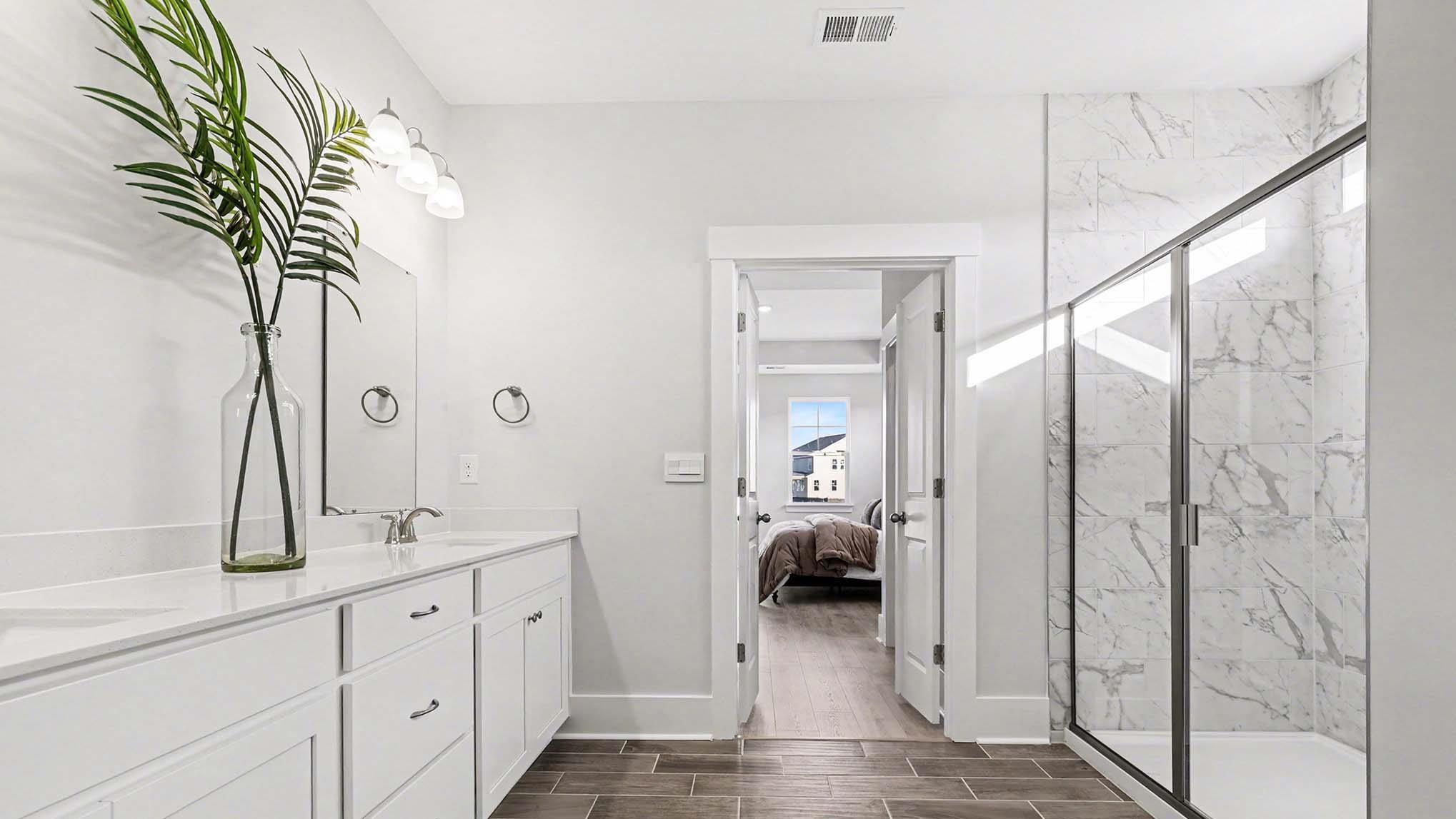3250 Moss Bridge Lane Myrtle Beach, SC 29579 - Photo 17 of 29 Ensuite bathroom with wood tiled floors, double vanity, and a marble finish shower