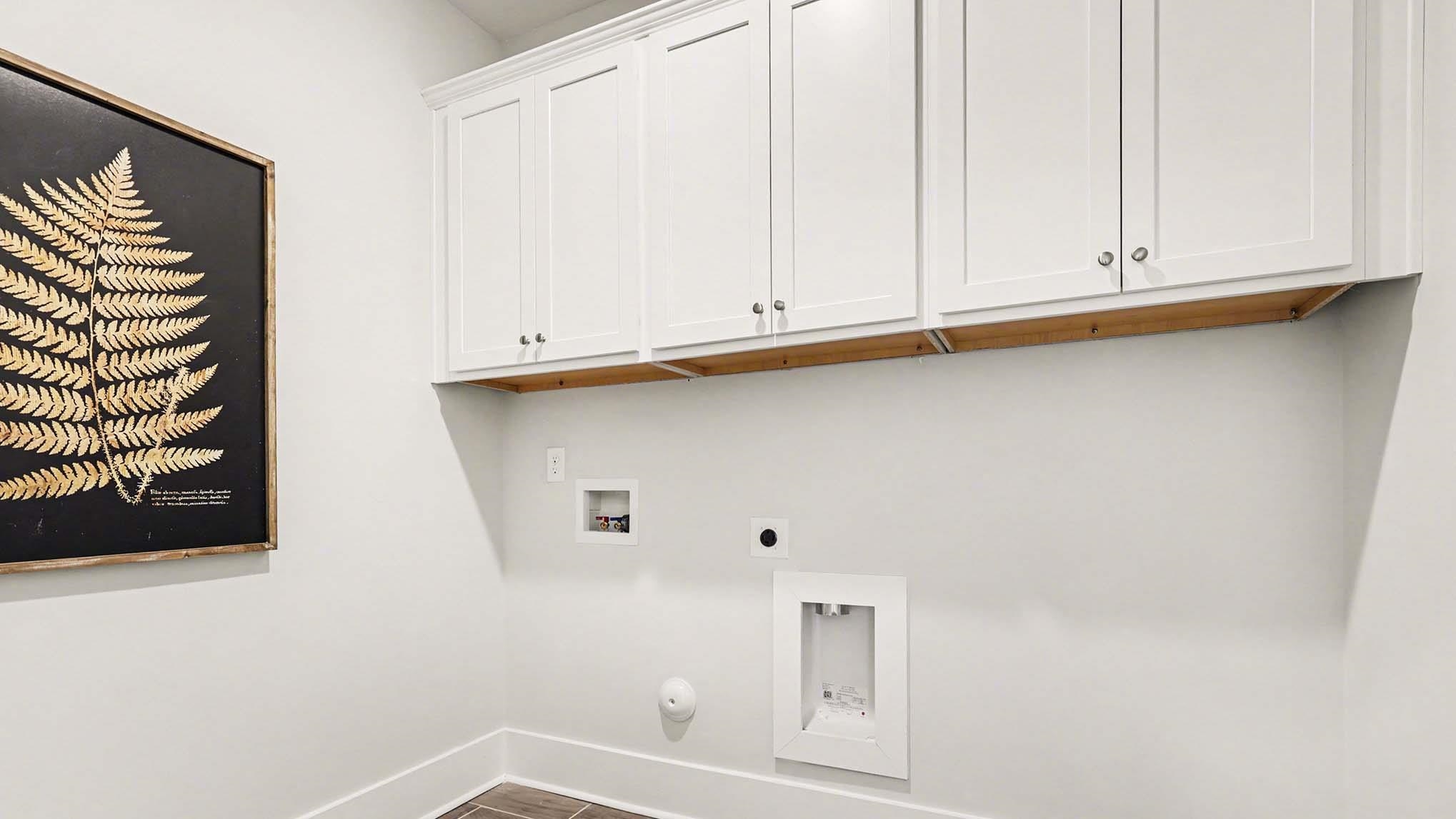 3250 Moss Bridge Lane Myrtle Beach, SC 29579 - Photo 21 of 29 Laundry area with hookup for a washing machine, hookup for an electric dryer, cabinet space, gas dryer hookup, and dark wood-style floors