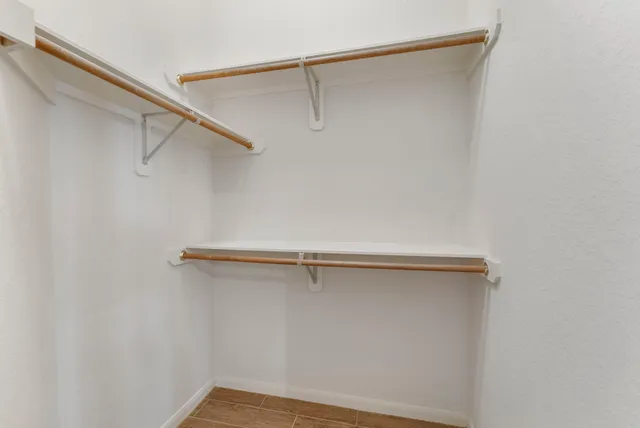 a bathroom with a double vanity sink mirror and