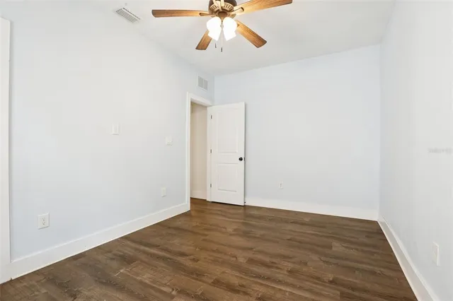 a view of a wooden chairs on the deck