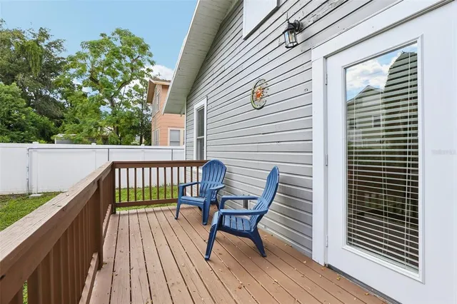 a view of balcony with wooden floor