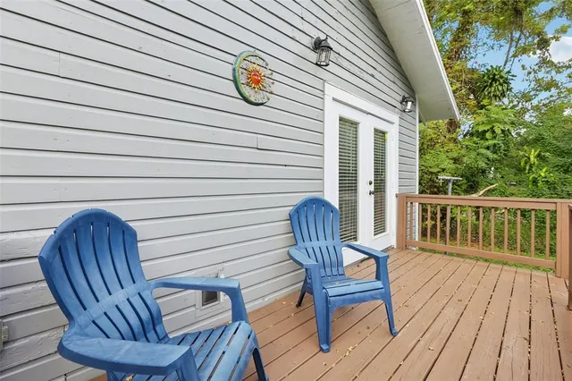 a view of a chair and table in the backyard