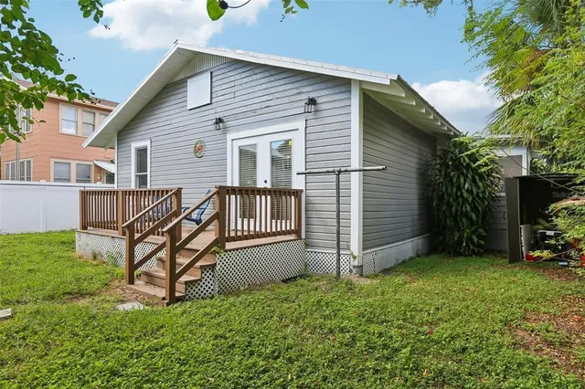 a view of balcony with two chairs and a table