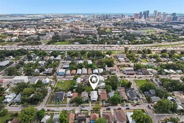 a view of a house with a yard and deck