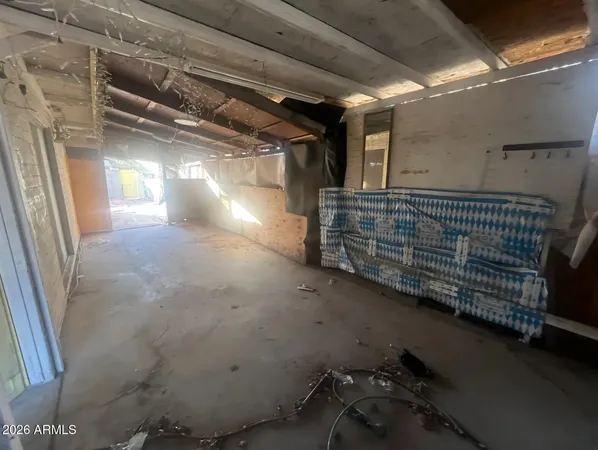 a view of a patio with table and chairs and potted plants