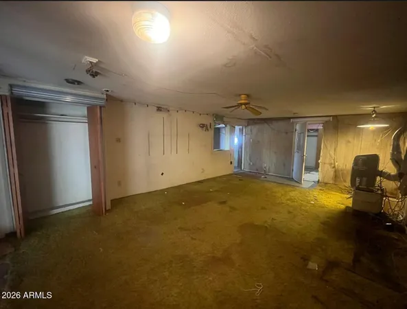 a bedroom with a bed and a view of bathroom