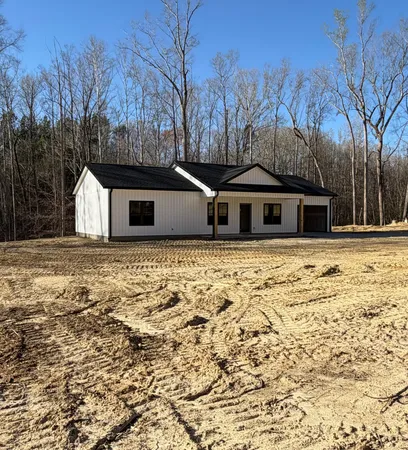 a house with trees in front of it