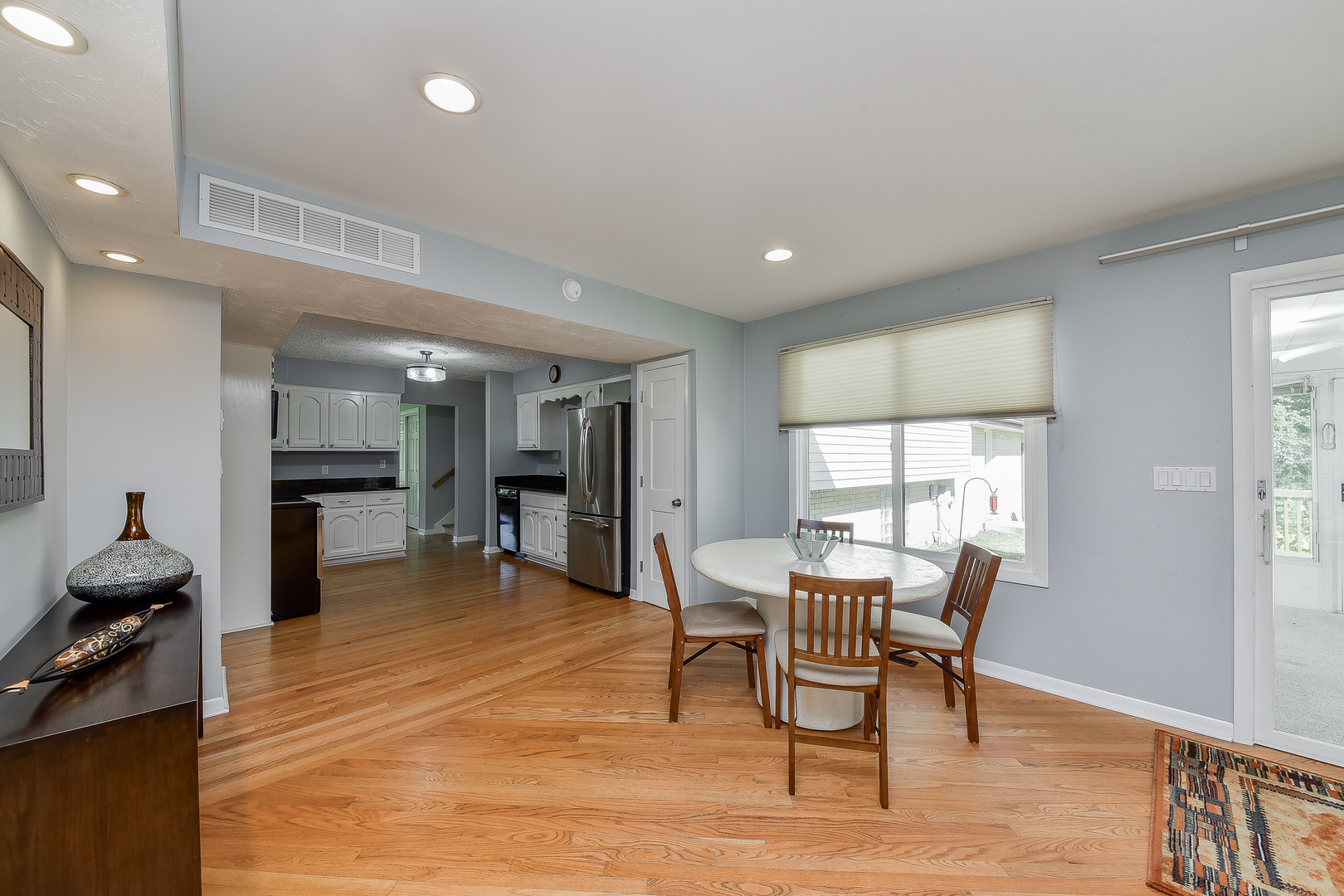 8645 Brookridge Road Downers Grove, IL 60516 - Photo 11 of 23 a dining room with furniture and window